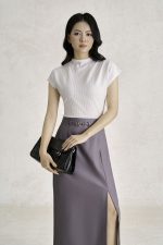 Wool knitted t-shirt with round neck and shoulder sleeves, styled with a shrug