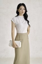 Wool knitted t-shirt with round neck and shoulder sleeves, styled with a shrug