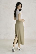 Wool knitted t-shirt with round neck and shoulder sleeves, styled with a shrug